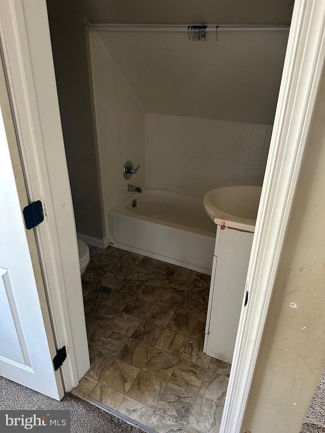 bathroom with tile floors, toilet, and vanity