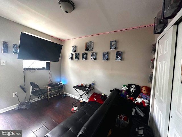 living room featuring dark wood-type flooring