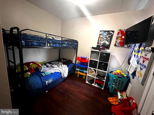 bedroom featuring dark hardwood / wood-style floors