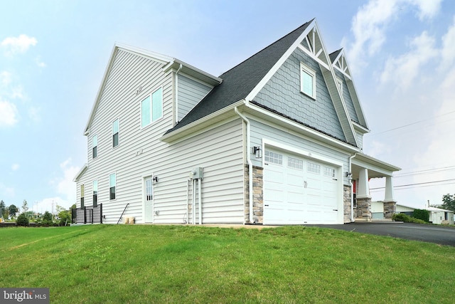 view of property exterior with a lawn and a garage