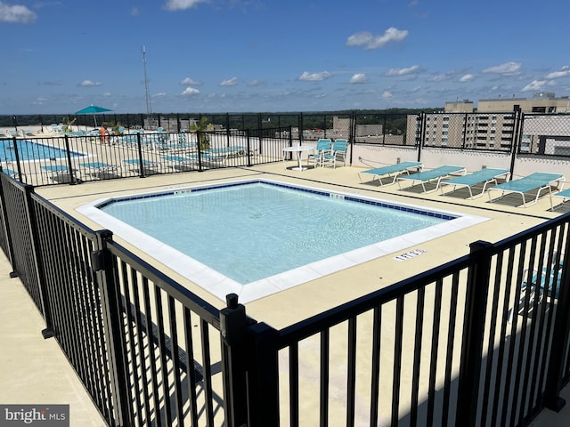 view of swimming pool featuring a patio