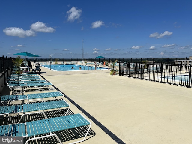 view of patio featuring a community pool