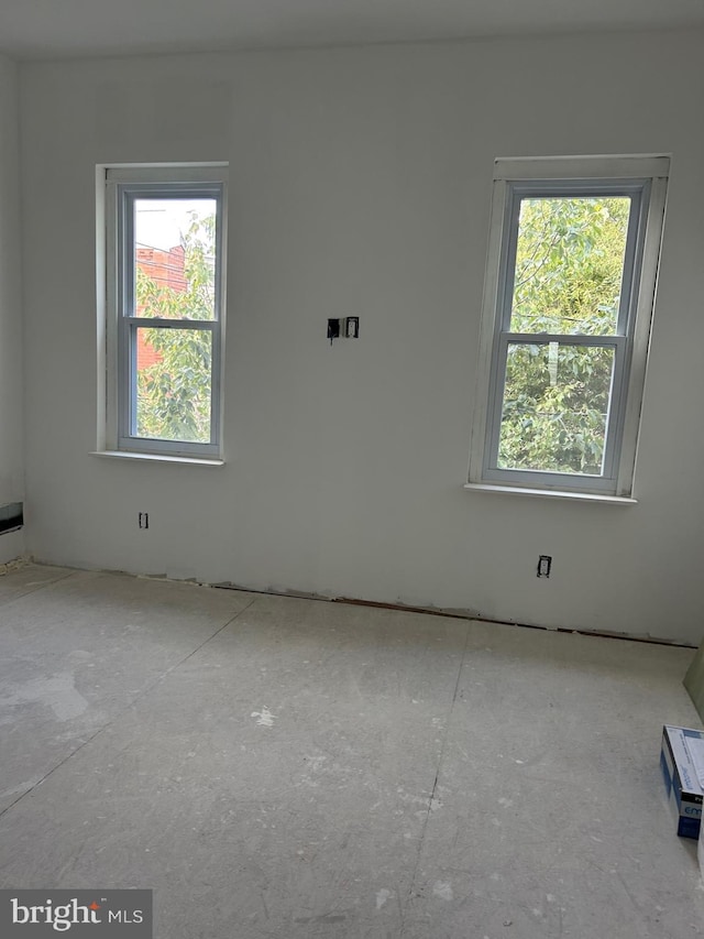 empty room featuring plenty of natural light