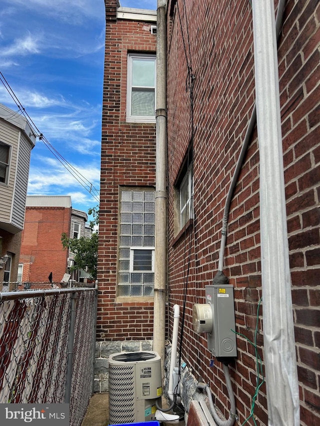 view of side of property with central AC