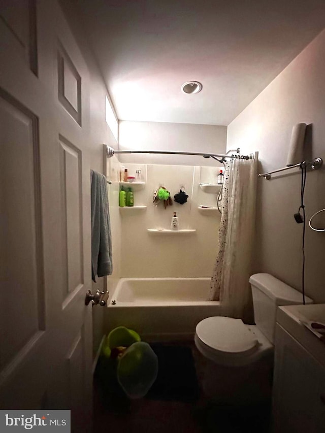 full bathroom featuring toilet, shower / bathtub combination with curtain, and vanity