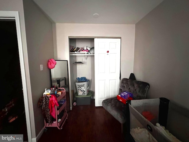 bedroom featuring a closet and dark hardwood / wood-style floors