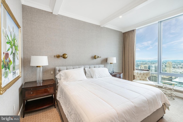 bedroom featuring light colored carpet and beamed ceiling