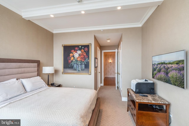 carpeted bedroom featuring crown molding and connected bathroom