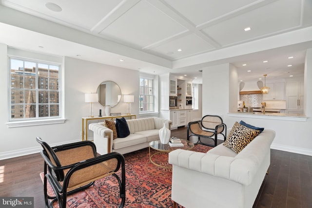 living room with coffered ceiling and dark wood-type flooring