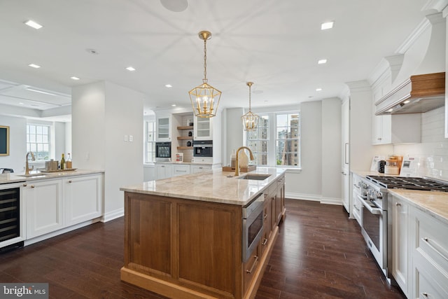 kitchen with appliances with stainless steel finishes, sink, dark hardwood / wood-style flooring, and white cabinets