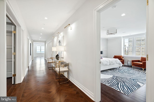 hall featuring dark parquet flooring