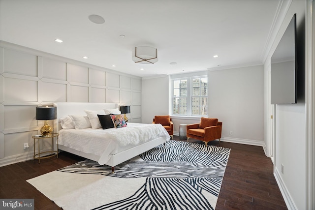 bedroom with dark hardwood / wood-style flooring and ornamental molding