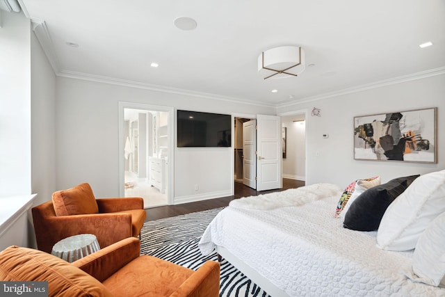 bedroom with crown molding, connected bathroom, and dark hardwood / wood-style floors