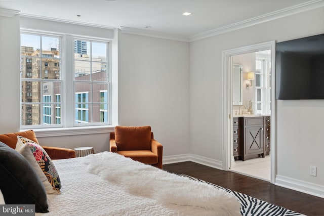 bedroom with sink, dark hardwood / wood-style flooring, ensuite bathroom, and ornamental molding