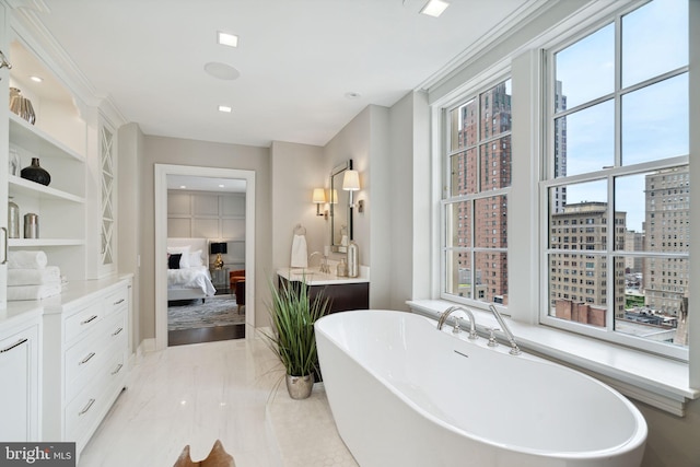 bathroom featuring built in shelves, tile floors, a bath, and oversized vanity