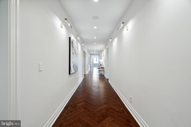 corridor with dark parquet flooring