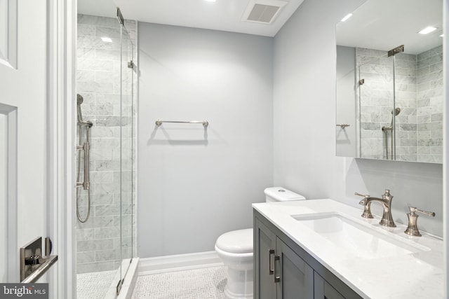 bathroom featuring tile flooring, a shower with door, toilet, and oversized vanity