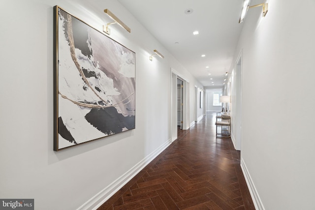 hallway with dark parquet floors