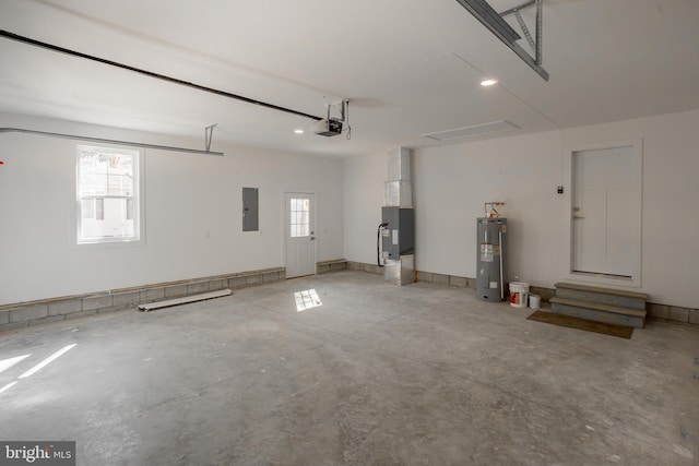 garage with water heater and a garage door opener