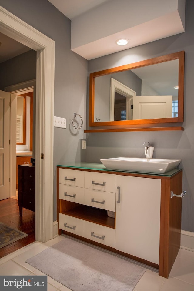 bathroom featuring wood-type flooring and vanity