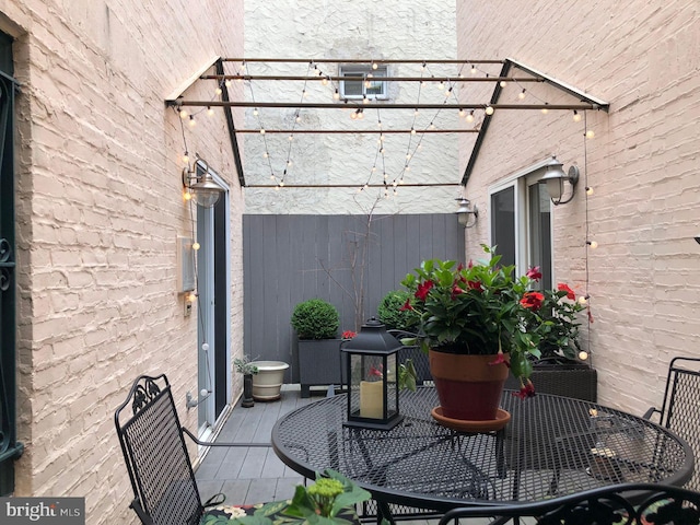 view of patio featuring a balcony