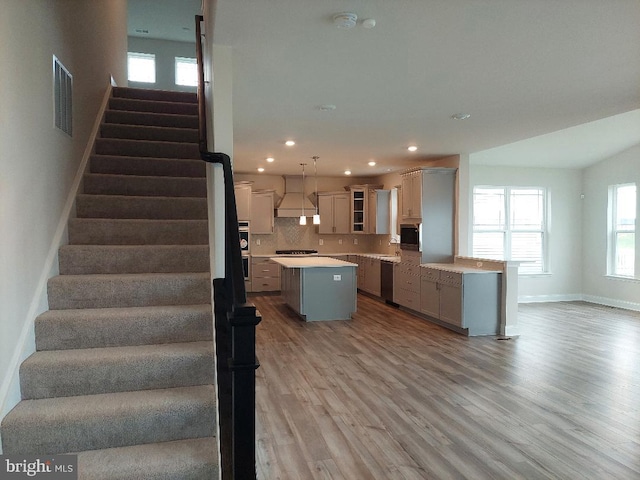 staircase featuring hardwood / wood-style floors