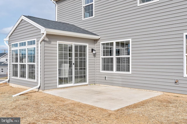 back of property featuring a patio area