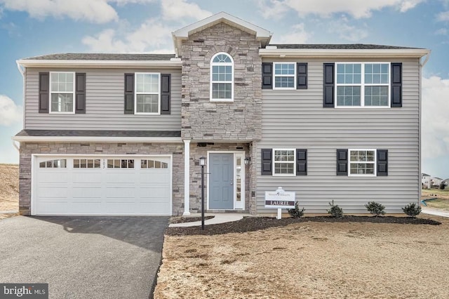 view of front of property with a garage