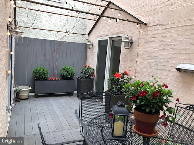 wooden deck featuring a pergola