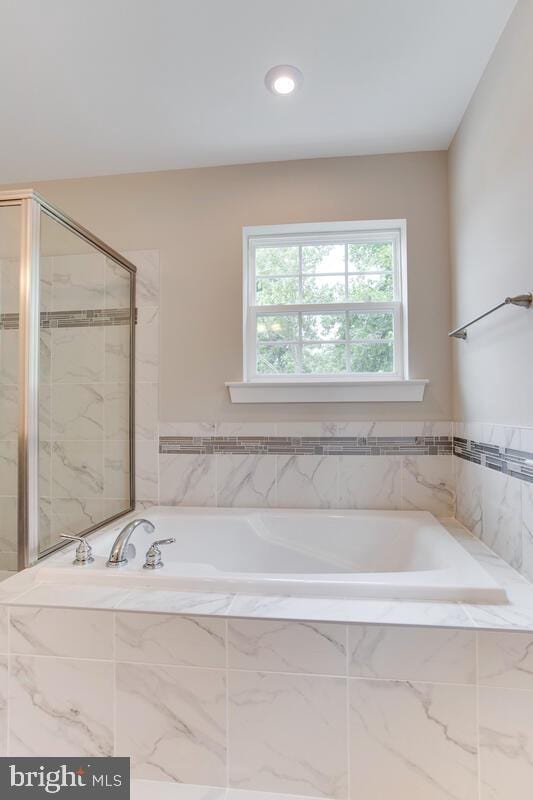 bathroom with independent shower and bath