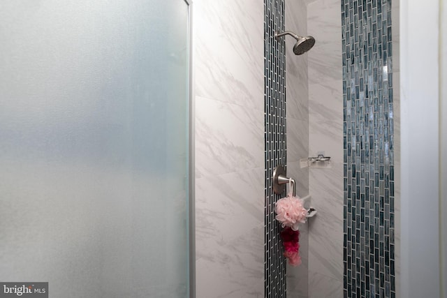 bathroom with a tile shower