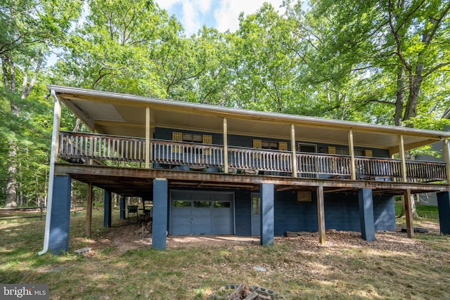 rear view of property with a wooden deck