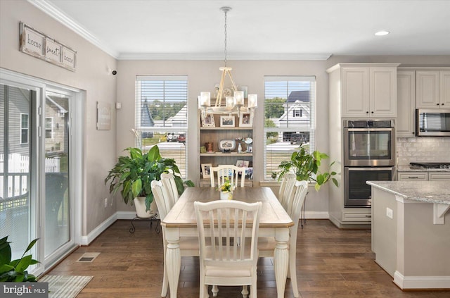 dining area featuring a notable chandelier, crown molding, a wealth of natural light, and dark hardwood / wood-style flooring