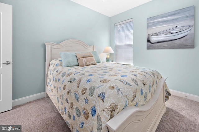 bedroom featuring light colored carpet