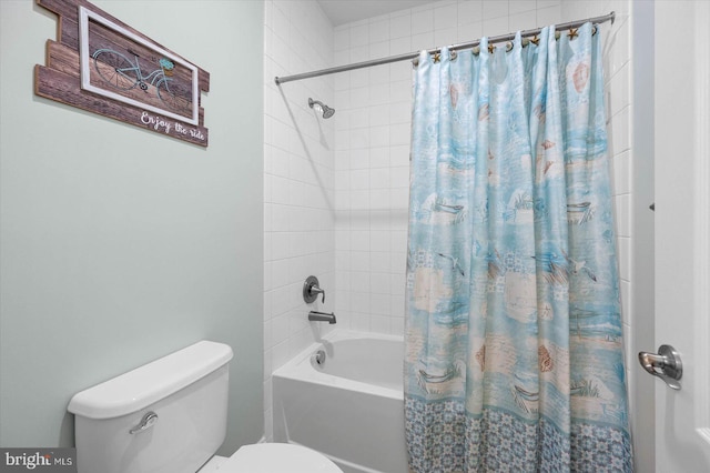 bathroom with shower / bath combination with curtain and toilet