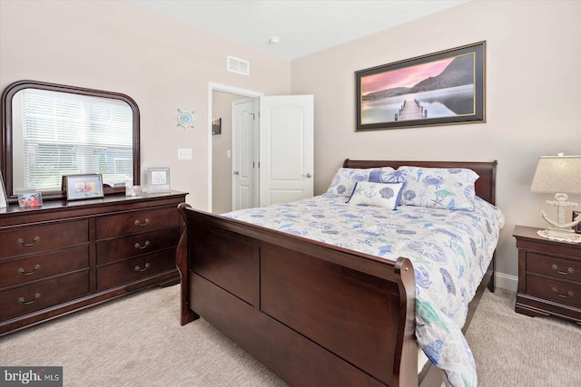 bedroom featuring light colored carpet