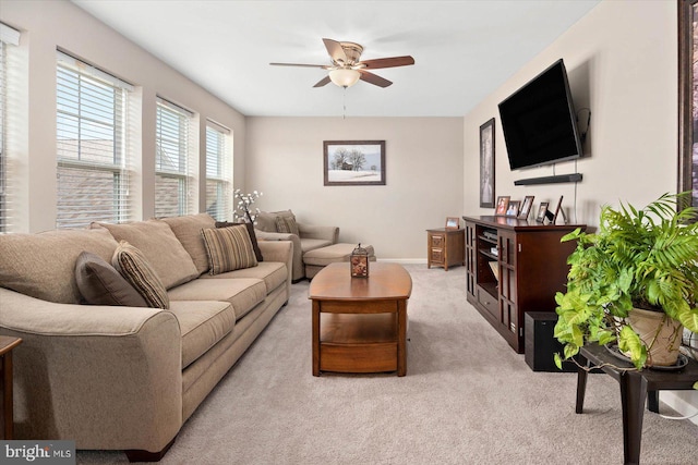 living room with light carpet and ceiling fan