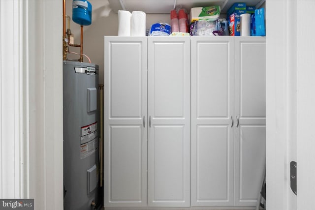 utility room with water heater