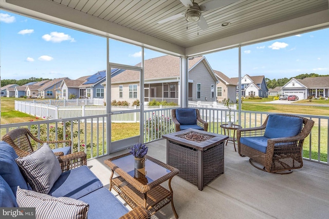 sunroom / solarium with ceiling fan