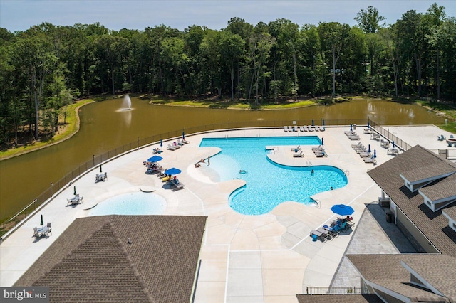 view of swimming pool with a patio