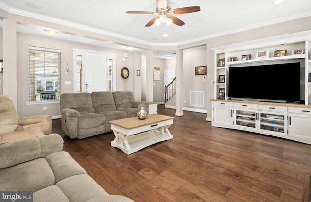 living room featuring ornamental molding, dark hardwood / wood-style flooring, and ceiling fan