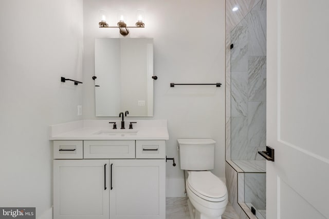 bathroom featuring vanity, toilet, and walk in shower