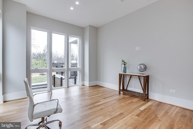 office with light hardwood / wood-style flooring