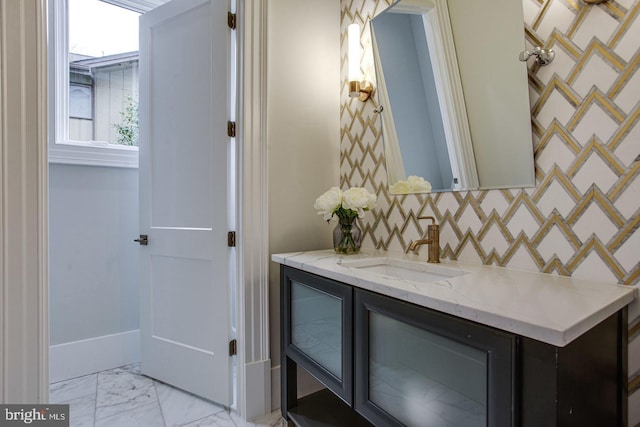 bathroom with vanity and backsplash