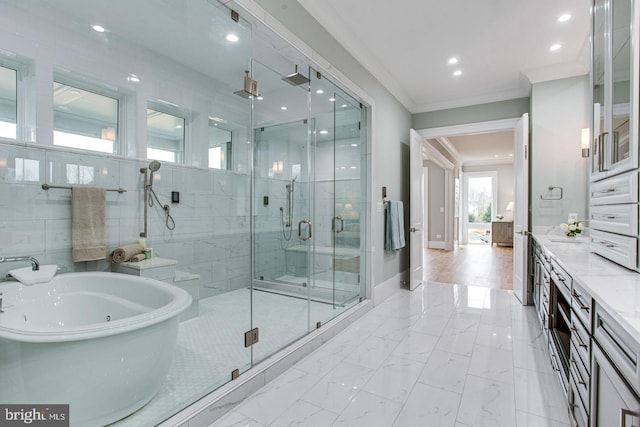 bathroom with plus walk in shower, vanity, and crown molding