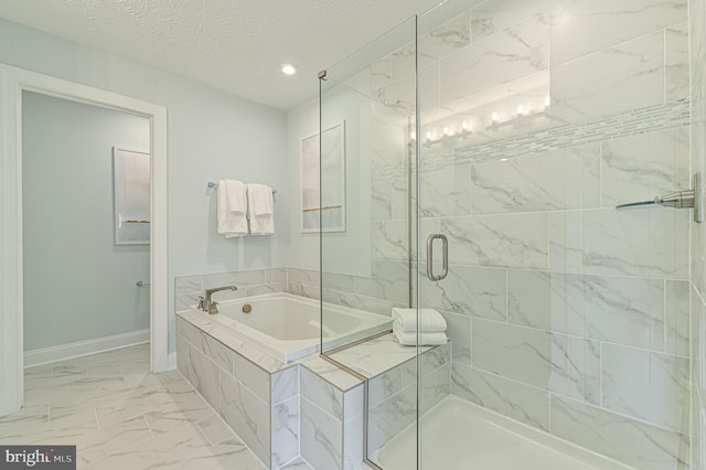 bathroom featuring tile flooring, a textured ceiling, and shower with separate bathtub