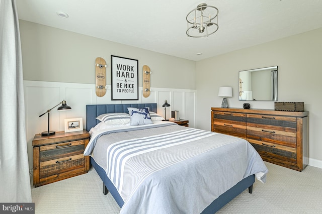 bedroom featuring light carpet