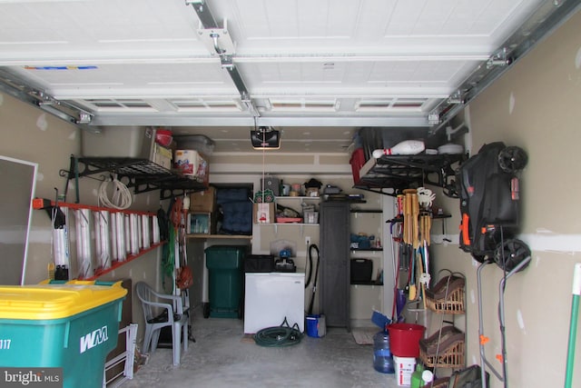 garage featuring a garage door opener