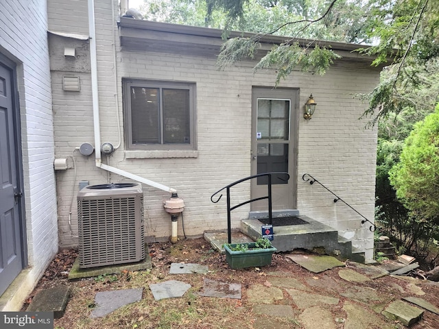 rear view of house with central air condition unit