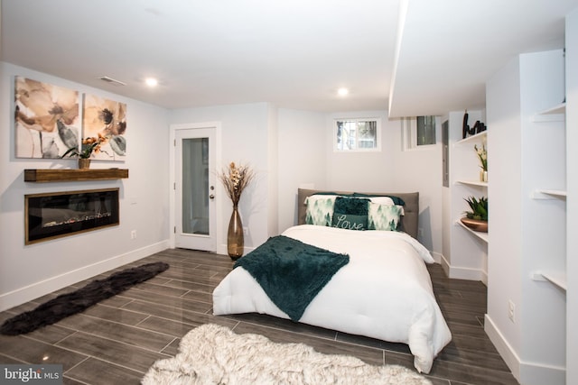 bedroom featuring dark hardwood / wood-style flooring